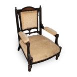 An Aesthetic Movement Ebonised and Gilded Armchair, arched fan toprail, upholstered arms, seat and