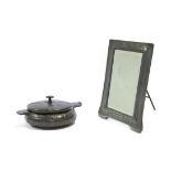 An Art Nouveau Pewter Easel Toilet Mirror, the top with three interlinking circles surrounded by