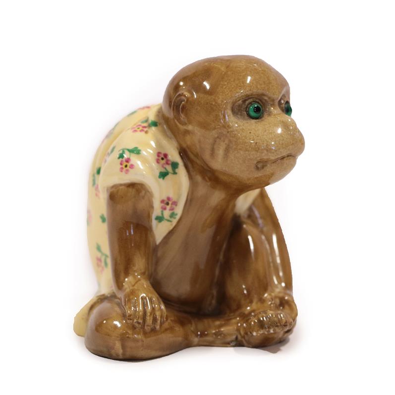 A Bernard Moore Monkey Menu Holder, in a seated pose, wearing a floral painted coat, unmarked, 9cm