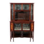 An Art Nouveau Leaded Glazed Mahogany Inlaid Display Cabinet, the upper section with two doors above