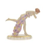 An Art Deco Royal Dux Figure, modelled as a nude young woman in a running pose, clasping a pink