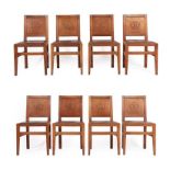 Squirrelman: A Set of Eight English Oak Panel Back Dining Chairs, the panels each with a carved