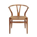 Hans Wegner (Danish, 1914-2007) for Carl Hansen: A 1970's CH24 Wishbone Chair, weaved cord seat,