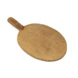 Workshop of Robert Mouseman Thompson (Kilburn): An English Oak Cheese Board, of standard form,