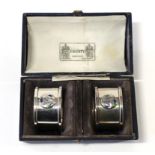 A Pair of Arts & Crafts Silver and Enamel Napkin Rings, made by William Hair Haseler, with