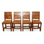 A Set of Four Sid Pollard of Thirsk English Oak Panel Back Dining Chairs, leather seats, on
