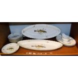 A Richard Ginori Porcelain fish service comprising two platters, two serving dishes, sauce boar