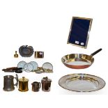 A silver mounted photograph frame, collection of magnifying glasses, a trench art paperweight, and a