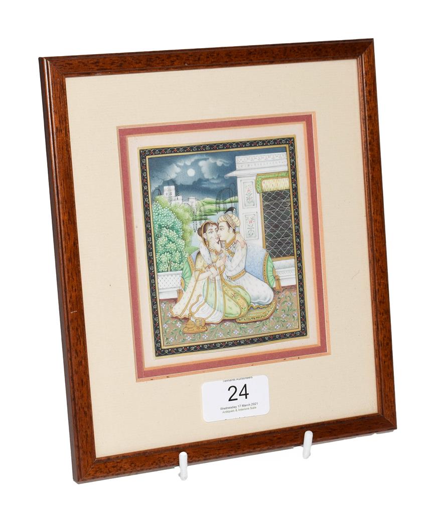 A 19th century Indian Mughal miniature painting on ivory, courting scene under a moonlit sky,