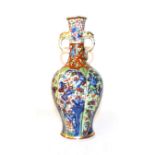 An 18th century Chinese vase of baluster form and with twin loop handles moulded with masks, painted
