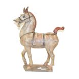 A Chinese terracotta figure of a horse, in the style of the Tang dynasty, modelled with removable