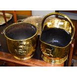 A brass helmet form coal scuttle and a early 20th century embossed coal scuttle (2)