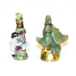 A 19th century Meissen scent bottle, formed as a boy wearing a tricorn hat chasing a goat,