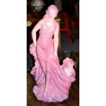 A large Continental pottery centrepiece formed as a maiden, 97cm