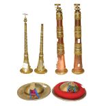 Two Bhutanese horns, of telescopic form, in brass and copper together with two Tibetan kanglings and