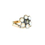 A split pearl mourning ring, unmarked, finger size P1/2 (a.f.). Gross weight 2.4 grams