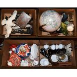 Four boxes of assorted items to include a modern desk globe, composite figures and a Paragon china