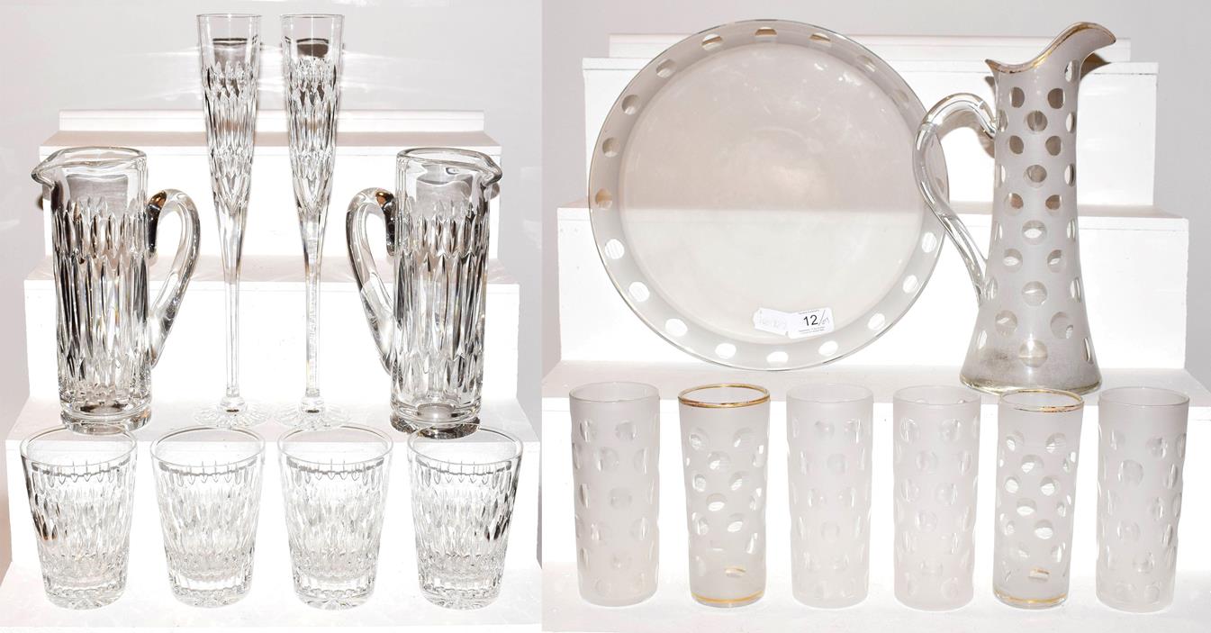 An Asprey & Garrard part suite of glassware with acid etched marks, including two ewers, large