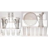An Asprey & Garrard part suite of glassware with acid etched marks, including two ewers, large