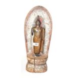 A silvered and gilt-metal standing Buddha, probably 19th century, on wooden painted plinth with