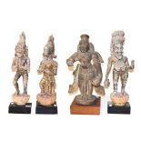 A set of three Indian carved giltwood figures, on later bases, largest 60cm high, together with