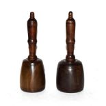 Two lignum vitae stonemasons mallets with turned mahogany handles, longest 25cm (2)