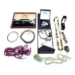 A quantity of costume jewellery including a silver gatelink bracelet, fastenings, an amethyst