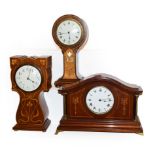 Three Edwardian mahogany inlaid timepieces