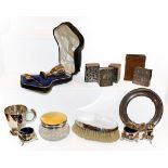 A collection of assorted silver to include a silver and enamel mounted cut-glass dressing-table jar;