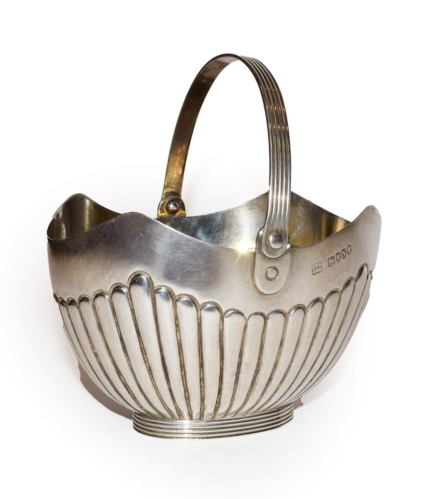 A Victorian silver sugar basket with swing handle by Hukin & Heath, London, 1888, 151 grams, 13cm