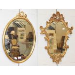 A modern ribbon tied gilt framed oval mirror, 40cm by 57cm, together with another gilt mirror in the