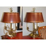 A pair of brass three branch rise and fall table lamps with Toleware shades, 62cm high