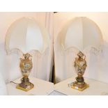 A pair of gilt metal and marble twin handle urn form table lamps, with ribbon tie and swag