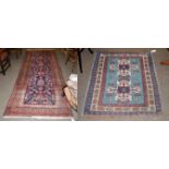 Turkish rug, the aquamarine field with two ivory medallions enclosed by ivory borders, 120cm by