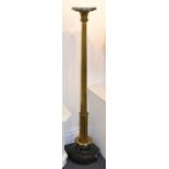 A marble and gilt metal torchere, the circular top above a reeded standard raised on an octagonal