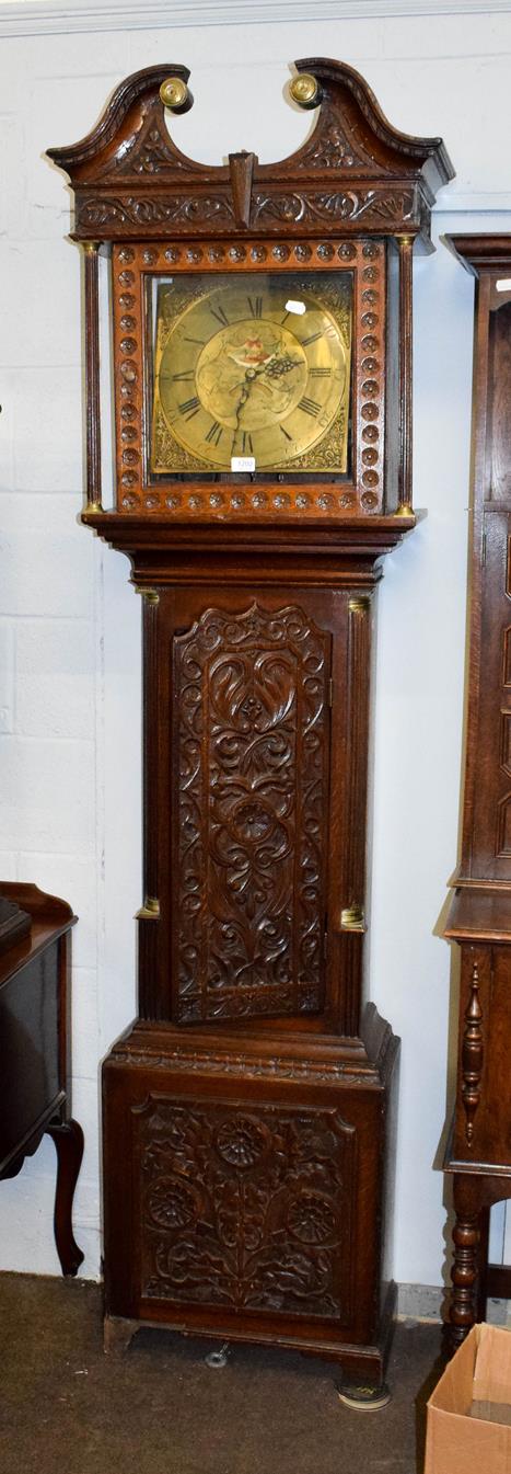 A carved oak thirty hour longcase clock, the square brass dial signed Ewbank, Elland