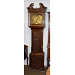 A carved oak thirty hour longcase clock, the square brass dial signed Ewbank, Elland
