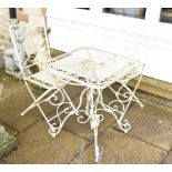 A white painted metal garden table 60cm square by 71cm high and two matching folding chairs