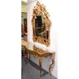 A modern mirrored gilt composition console table, 146cm by 48cm by 83cm in the rococo taste together