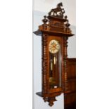 A Victorian Vienna type double weight driven wall clock, circa 1890, 120cm high