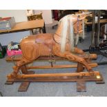 A 20th century rocking horse on trestle base bearing plaque for Colin Grimmitt, Rocking Horse