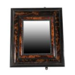 A Late 19th Century Flemish Style Tortoiseshell and Ebonised Wall Mirror, the bevelled glass plate