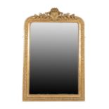 {} A Victorian Gilt and Gesso Overmantel Mirror, circa 1870, the rectangular plate within a