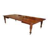 A Victorian Brown Oak Extending Dining Table, circa 1870, with three original additional leaves, the