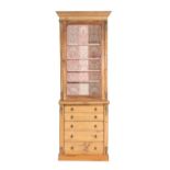 A Victorian Glazed Pine Bookcase, 3rd quarter 19th century, the top probably associated, the later