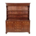 A Late George III Oak and Pine-Lined Dresser and Rack, the moulded cornice above a crossbanded