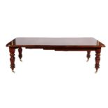 A Victorian Mahogany Extending Dining Table, circa 1870, with three original additional leaves,