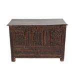 A Joined Oak Chest, the later hinged lid above five carved panels all between carved stiles and