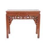 A Chinese Elm Altar Table, early 20th century, of rectangular form above a carved apron with