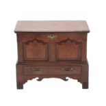 An 18th Century Joined Oak Chest, the hinged lid enclosing a vacant interior above two moulded